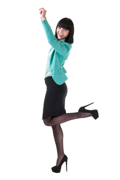 Successful young business woman happy for her success jumping. Isolated full body image on white background. — Stock Photo, Image