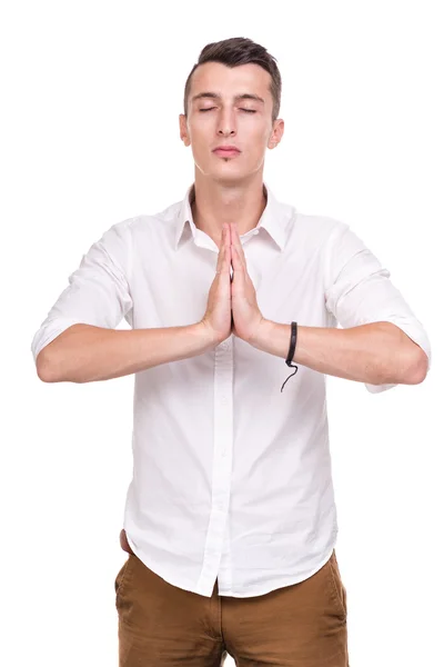 Hombre de negocios en namaste pose contra aislado blanco —  Fotos de Stock