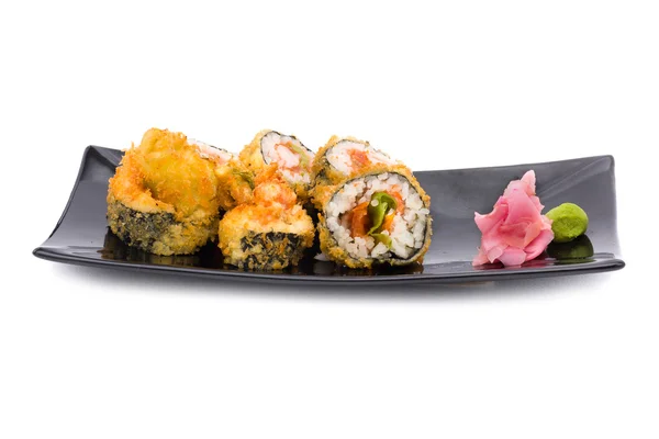 Traditionnel frais japonais sushi rouleaux sur un blanc — Photo