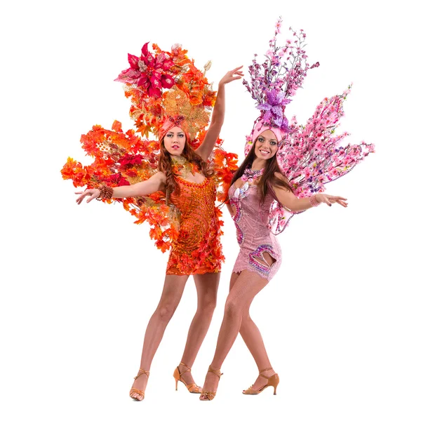 Two carnival dancer women dancing against isolated white — Stock Photo, Image