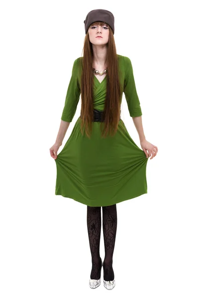 Frau trägt ein grünes Kleid auf weißem Hintergrund — Stockfoto