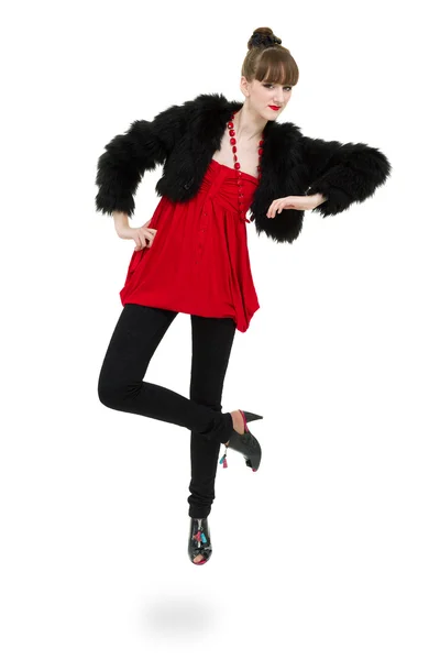 Woman trying jacket with fur jumping — Stock Photo, Image