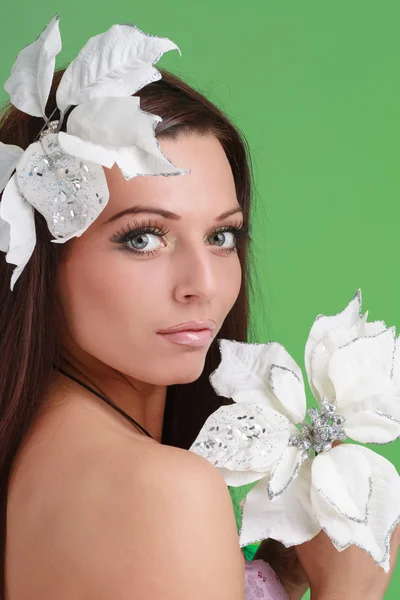 Adult woman with beautiful face and white flowers