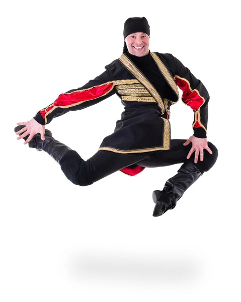 Young man wearing a folk costume jumping against isolated white with copyspace — Stock Photo, Image