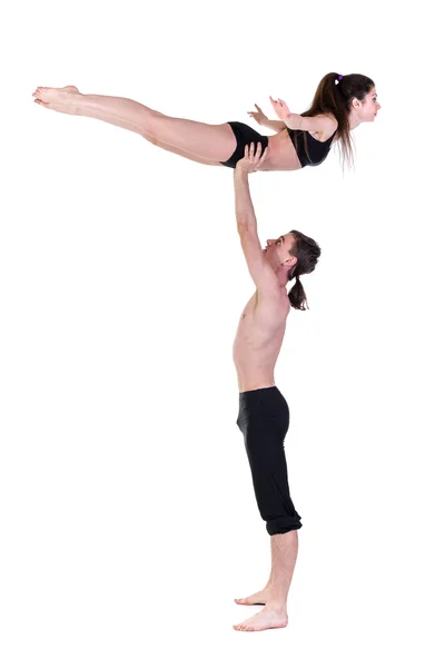 Casal homem e mulher exercitando fitness dançando no fundo branco — Fotografia de Stock