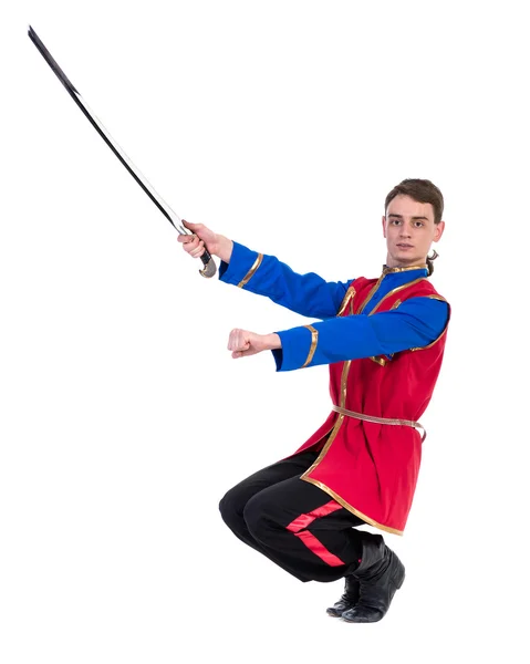 Russian cossack dance. Young dancer posing with sword — Stock Photo, Image