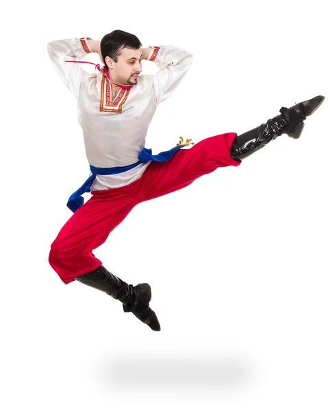 Young man wearing a folk costume jumping against isolated white with copyspace — Stock Photo, Image