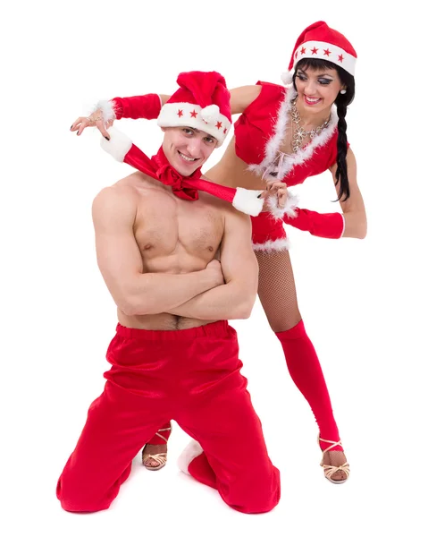 穿上圣诞老人衣服的快乐年轻夫妇 — 图库照片