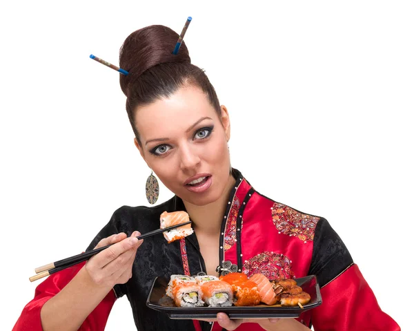 Mulher em vestido vermelho tradicional com comida oriental — Fotografia de Stock