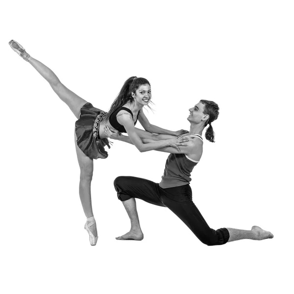 Colorless portrait of couple man and woman exercising fitness dancing on white background — Stock Photo, Image