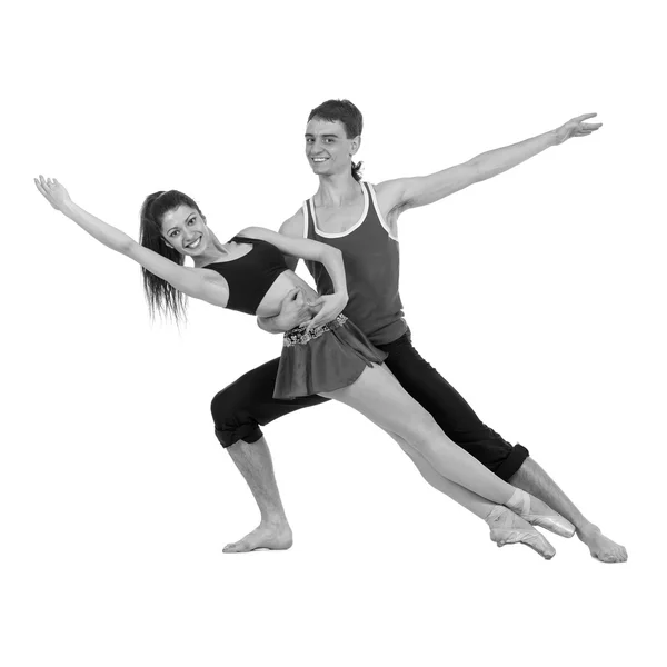 Colorless portrait of couple man and woman exercising fitness dancing on white background — Stock Photo, Image