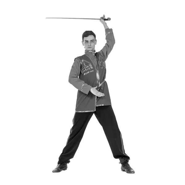 Colorless portrait of Russian cossack dance. Young dancer posing with sword — Stock Photo, Image