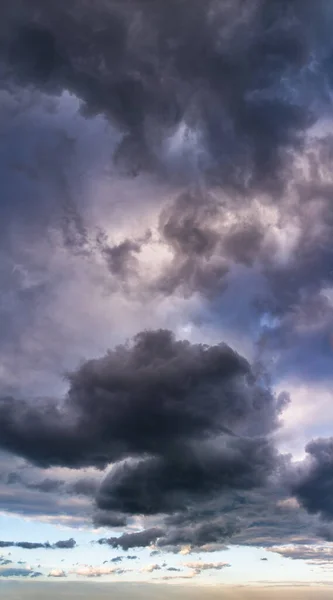 Fantastic soft thunderclouds, vertical panorama natural composition