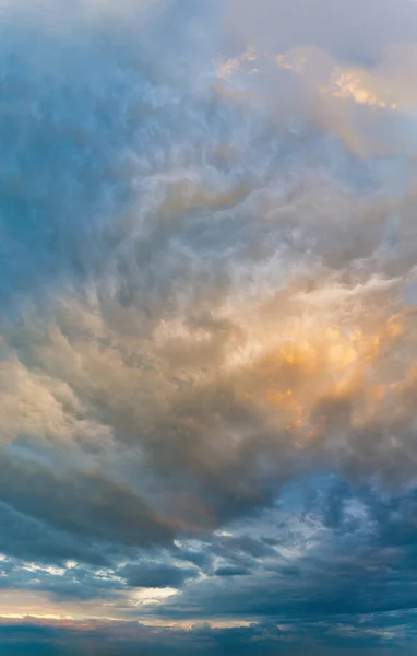 Fantastic clouds at sunrise, vertical panorama — Stock Photo, Image