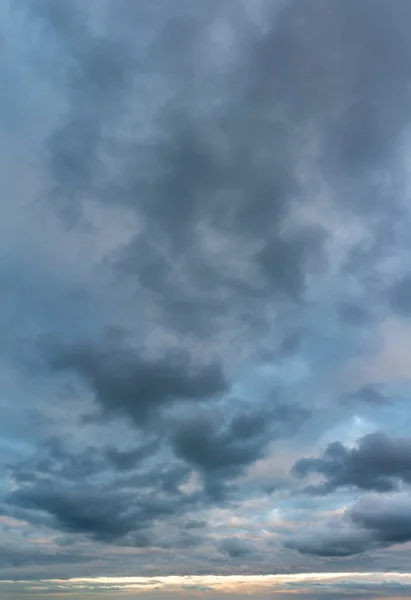 Fantastic clouds at sunrise, vertical panorama — Stock Photo, Image