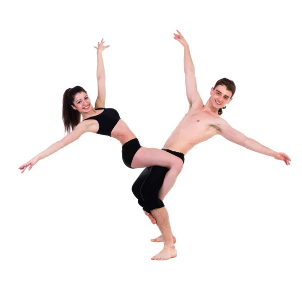 Casal homem e mulher exercitando fitness dançando no fundo branco — Fotografia de Stock