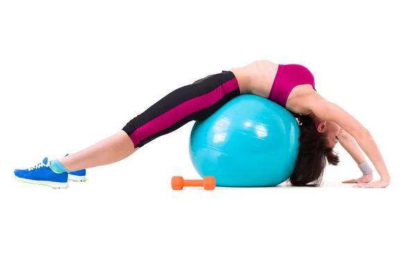 Young smiling woman makes exercise with fitball — Stock Photo, Image