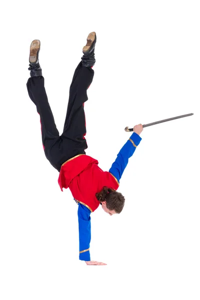 Russian cossack dance. Young dancer posing with sword — Stock Photo, Image