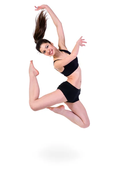 Young modern ballet dancer jumping on white background — Stock Photo, Image