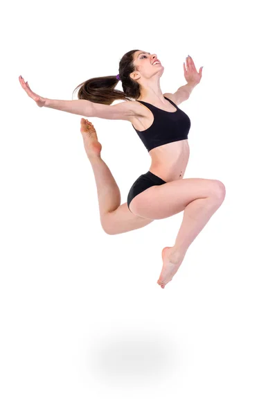 Young modern ballet dancer jumping on white background — Stock Photo, Image