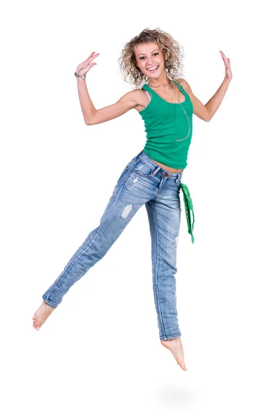 Junge Tänzerin springt vor weißem Hintergrund — Stockfoto