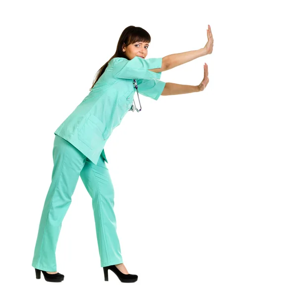 Ženský lékař tlačí nebo opřený o zeď — Stock fotografie