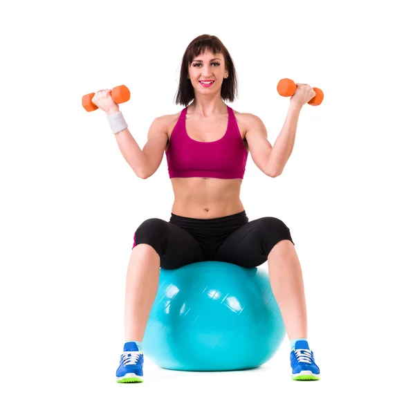 Young smiling woman makes exercise with fitball, full length portrait isolated over white — Stock Photo, Image