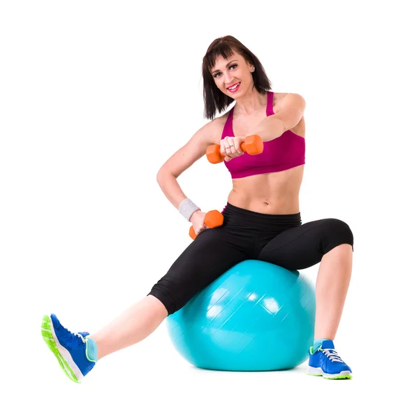 Young smiling woman makes exercise with fitball, full length portrait isolated over white — Stock Photo, Image