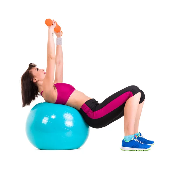Young smiling woman makes exercise with fitball, full length portrait isolated over white — Stock Photo, Image