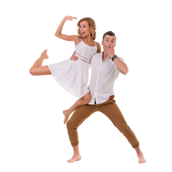 Surprised young couple on white background, isolated — Stock Photo, Image