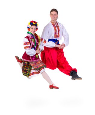beautiful dancing couple in ukrainian polish national traditional costume clothes jumping, full length portrait isolated