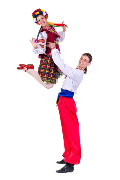 Beautiful dancing couple in ukrainian polish national traditional costume clothes jumping, full length portrait isolated — стокове фото