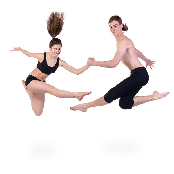 Couple man and woman jumping on white background — Stock Photo, Image