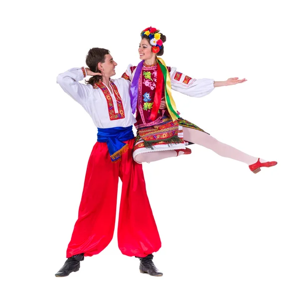 Beautiful dancing couple in ukrainian polish national traditional costume clothes jumping, full length portrait isolated Royalty Free Stock Fotografie