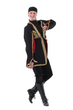 young man wearing a folk costume dancing against isolated white with copyspace