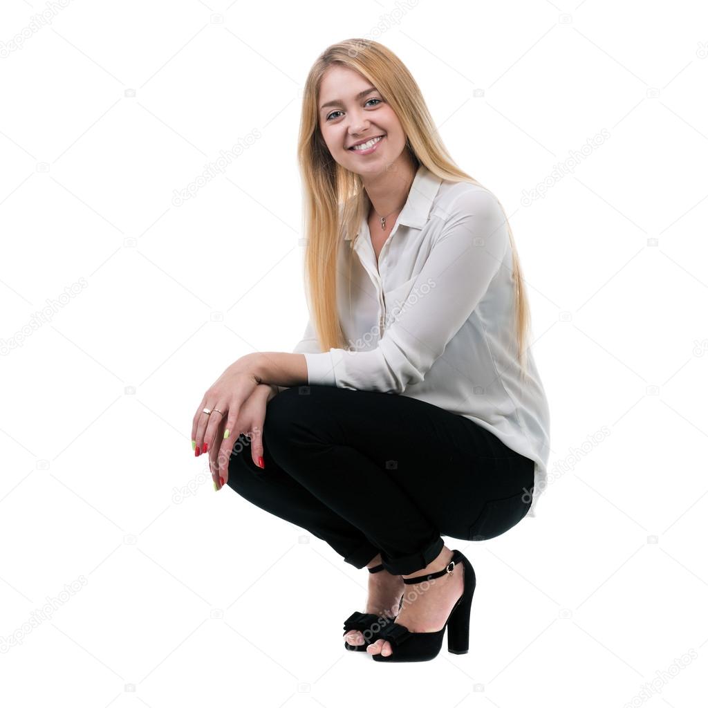 Full length of beautiful blond business woman sitting over white background with copy space