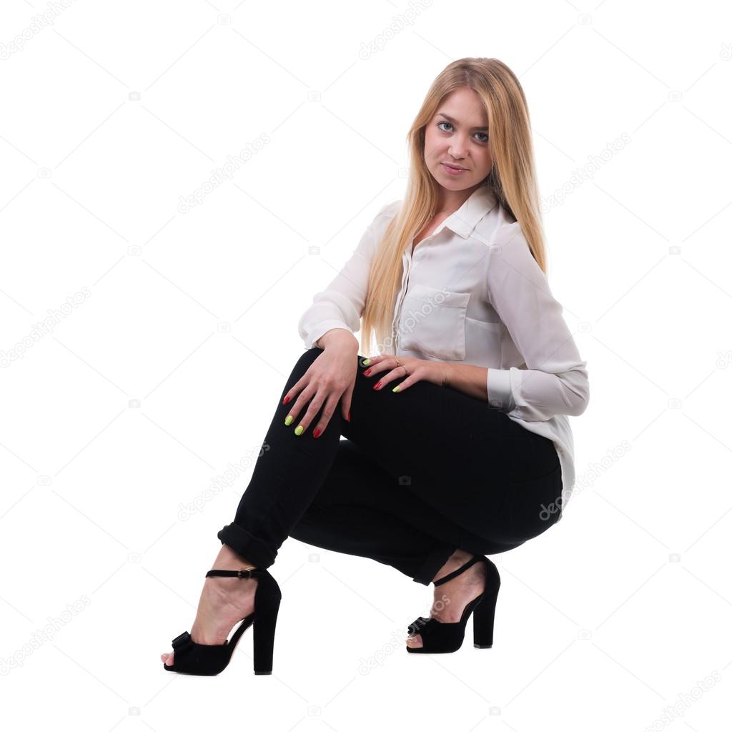 Full length of beautiful blond business woman sitting over white background with copy space