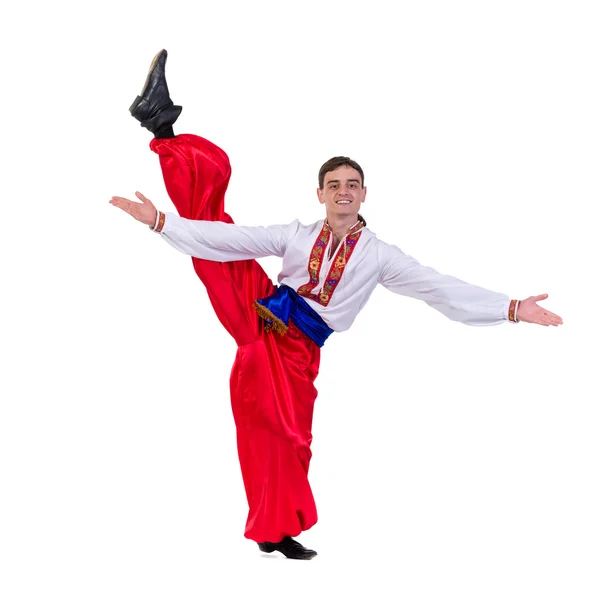 Young man wearing a folk russian costume dancing against isolated white with copyspace — Stock Photo, Image