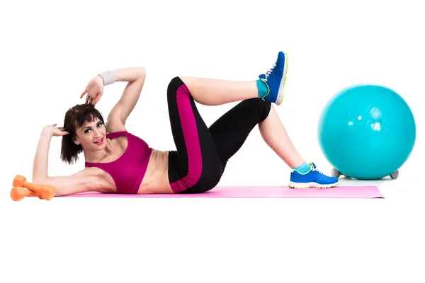 Young smiling woman makes exercise with fitball — Stock Photo, Image