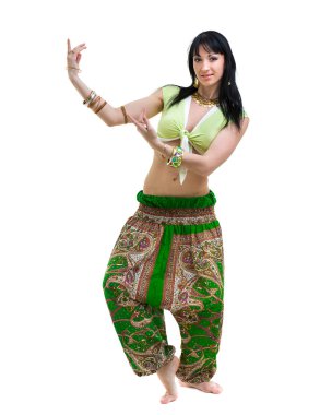 full length portrait of indian woman dancing in studio.  Isolated on white