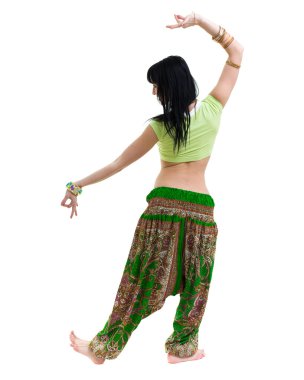 full length portrait of indian woman dancing in studio.  Isolated on white