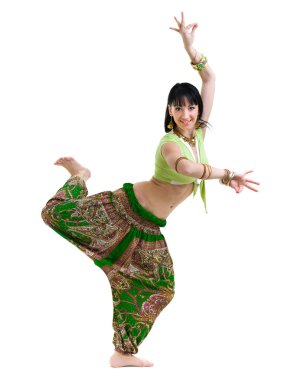 full length portrait of indian woman dancing in studio.  Isolated on white