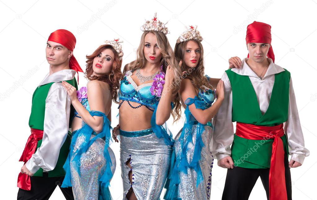 Carnival dancer team dressed as mermaids and pirates.  Isolated on white background in full length.