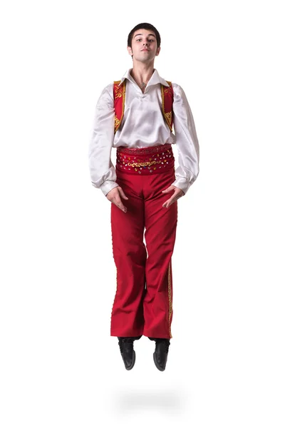 Jumping man wearing a toreador costume. Isolated on white in full length. — Stock Photo, Image