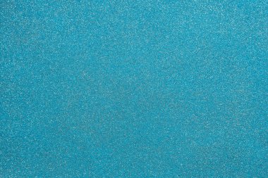Texture of decorative blue plaster with white dots, background.