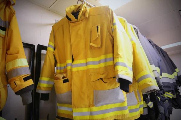 Firefighter suit and equipment ready for operation, Fire fighter room for store equipment, Protection equipment of fire fighter — Stock Photo, Image