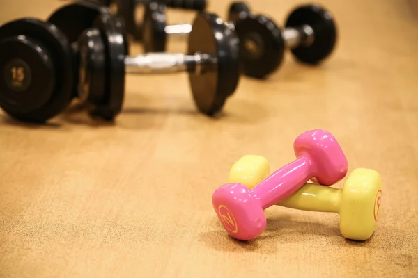 Sport equipment in fitness room or gym room, relax room for healthy people, Dumbbell in fitness and gym room. — Stock Photo, Image