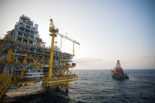 Large crane vessel installing the platform in offshore,crane barge doing marine heavy lift installation works in the gulf or the sea