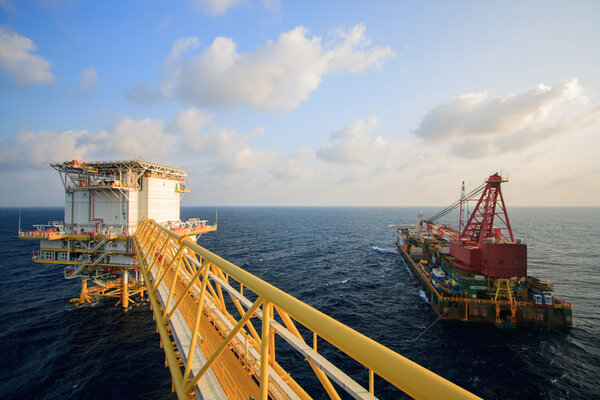 Large crane vessel installing the platform in offshore,crane barge doing marine heavy lift installation works in the gulf or the sea