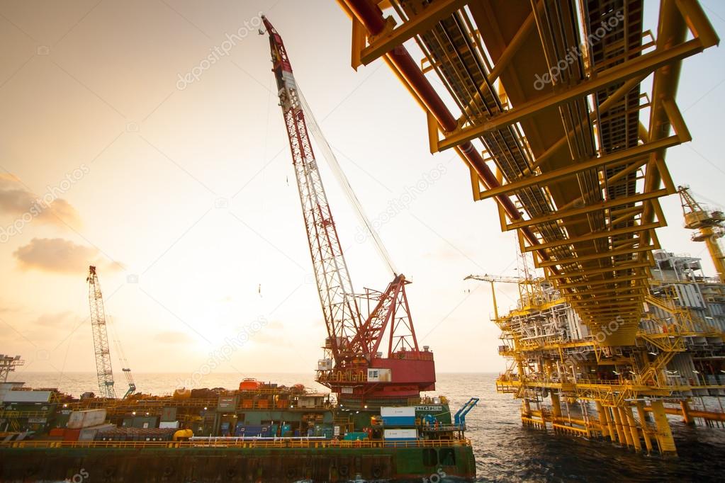 Large crane vessel installing the platform in offshore,crane barge doing marine heavy lift installation works in the gulf or the sea